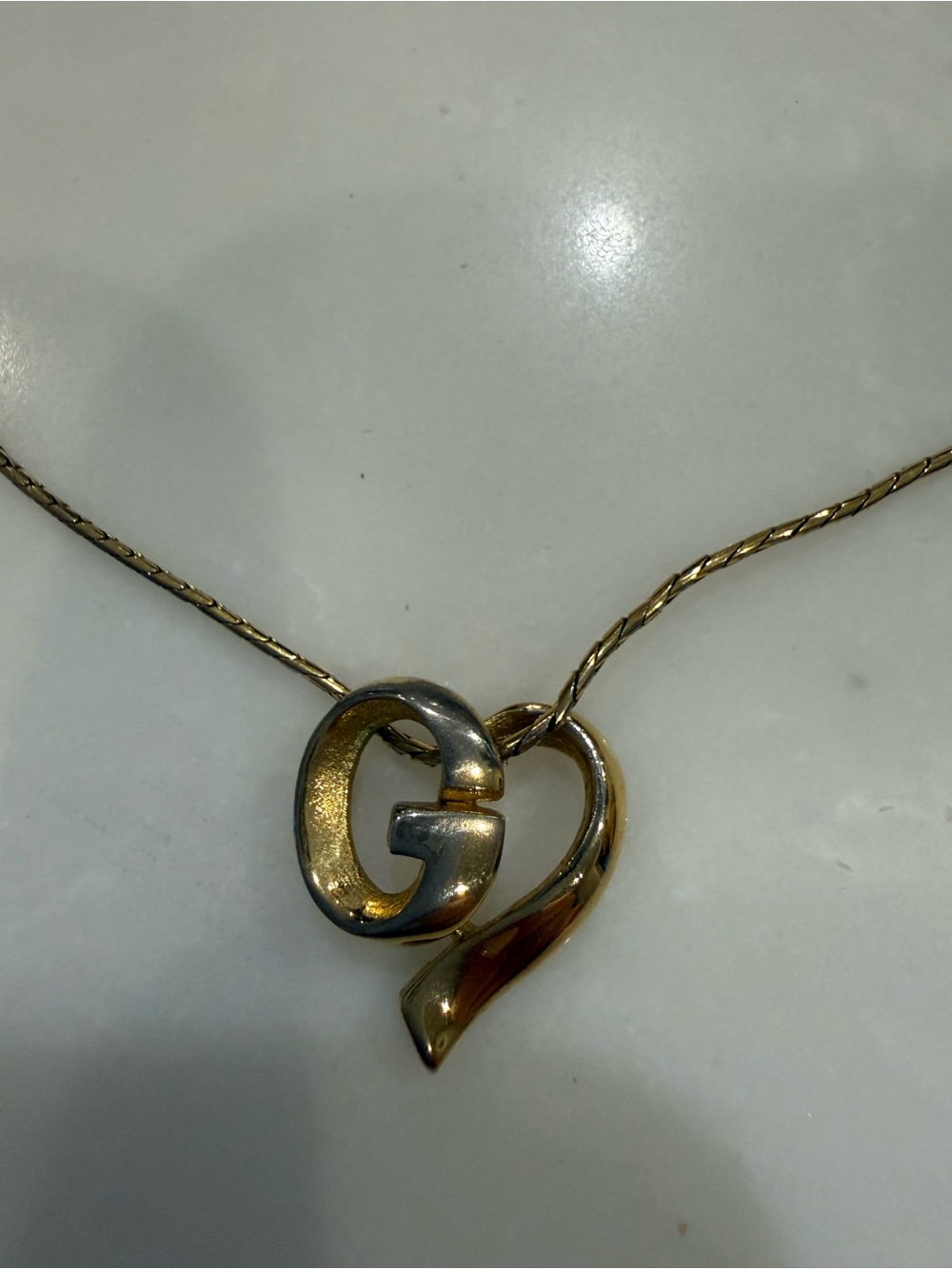 Goldtone GIVENCHY G WITH HEART MOTIF